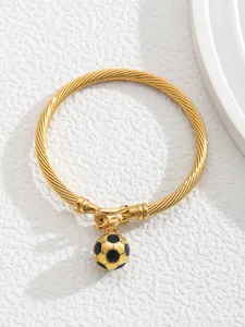 Detail of 18K gold-plated twisted cable bracelet featuring a unique soccer ball pendant