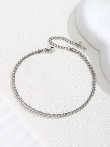 Detail of silver stainless steel double layered bead chain anklet with lobster clasp