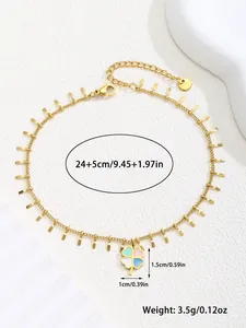 Detailed macro view of gold four-leaf clover anklet with colorful enamel and dimensions