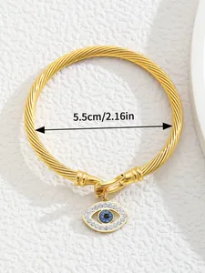 Detail of 18K gold-plated C-shaped cuff bracelet with Evil Eye charm and dimensions