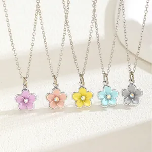 Colorful floral pendant necklaces in five pastel shades with sparkling crystal centers