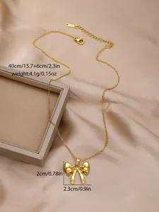 Detail view of gold butterfly bow necklace with dimensions and stainless steel lobster clasp