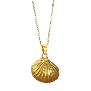 Elegant gold-tone seashell pendant necklace with a delicate chain on white background