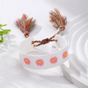 Bohemian white embroidered bracelet with pink floral patterns and colorful tassels
