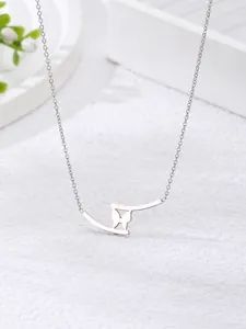Detailed view of silver butterfly pendant with sleek metal bar on delicate link chain