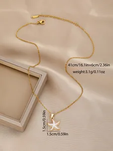Detailed view of gold starfish pendant with white enamel inlay and S.STEEL material tag