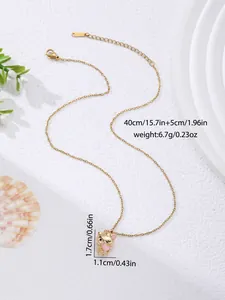 Detail of gold stainless steel necklace with a cute cat pendant holding a pink heart