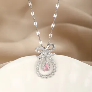 S925 silver necklace with a sparkling bow pendant and pink teardrop zircon on silk