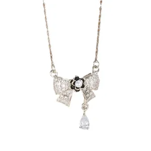 S925 silver bow necklace with pink zircon tassels and pearl floral accent pendant