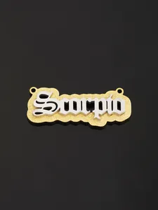 Macro detail of Scorpio zodiac pendant in gold and silver finish on black background