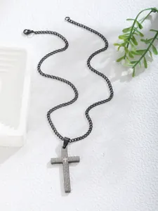 Detailed view of black stainless steel cross pendant with engraved Lord's Prayer text