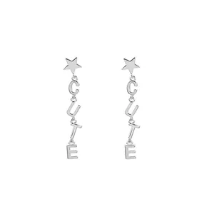 Silver star drop earrings with hanging letters spelling CUTE in a minimalist style