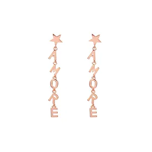 Rose gold five-point star earrings with AMORE letter tassels on a plain white background