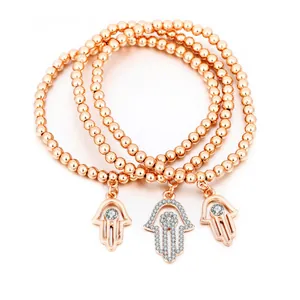 Dreiteiliges Perlenarmband-Set in Roségold mit Hamsa-Hand-Anhänger und Zirkonia-Besatz