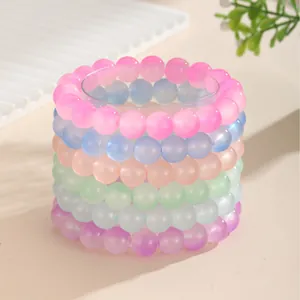 Set de seis pulseras elásticas de cuentas de resina traslúcida en tonos pastel mate