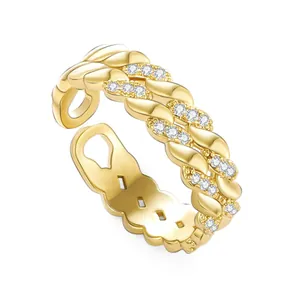 Adjustable gold layered twist ring with crystal inlay and hollow heart detail
