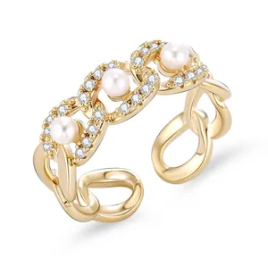 Elegant 18K gold-plated chain ring with three pearls and pavé-set zircons on white background