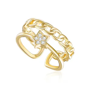 Detailed close-up of golden hollow layered ring with star and zircon inlay details
