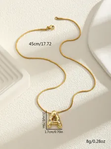 Detail view of gold letter A pendant with cubic zirconia and 45cm snake chain