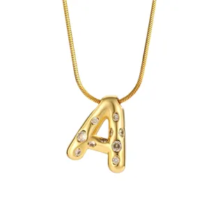 Gold letter A pendant necklace with cubic zirconia stones on a sleek snake chain