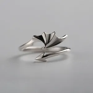 Adjustable silver demon wing ring with an asymmetric open design and arrow tail detail