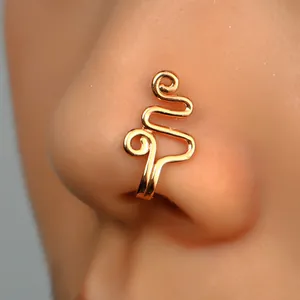 Detailed close-up of a golden non-pierced spiral nose cuff on a model nose