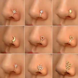 Nine gold non-pierced nose clips with cubic zirconia heart and star designs