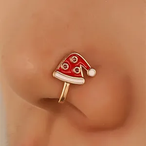 Close-up of Santa hat faux nose ring clip with red enamel and sparkling rhinestones