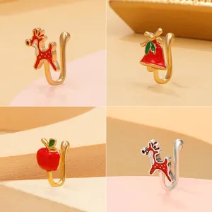 Christmas themed U-shaped non-piercing nose clips set with enamel deer and bell designs