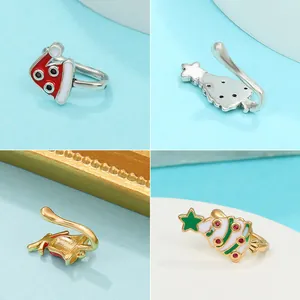 Christmas theme enamel U-shaped faux nose rings featuring Santa hat and tree designs