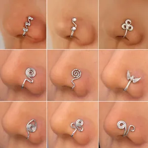 Set of 9 silver non-pierced U-shaped nose cuffs with zircon and bat designs on model
