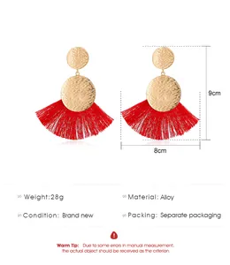 Detailed size view of red bohemian fan fringe earrings with hammered gold metal texture
