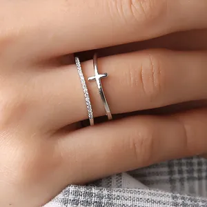 Elegant rose gold double-layer cross ring featuring a sparkling cubic zirconia stone pave