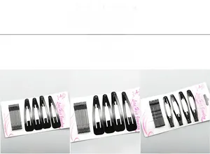 Detailed set of black bobby pins and snap clips mounted on a white display card