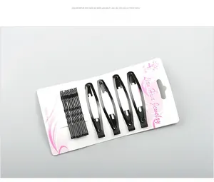 Detail view of 18 black metal bobby pins and snap clips set on cardboard display