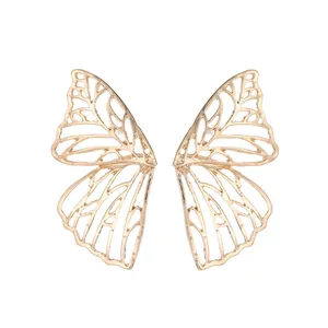 Elegant gold hollow butterfly wing stud earrings with intricate filigree texture