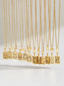 Detailed display of twelve gold zodiac pendant necklaces featuring engraved constellation names