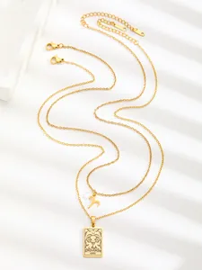 Detail of layered gold stainless steel Aries necklace with tarot style zodiac pendant