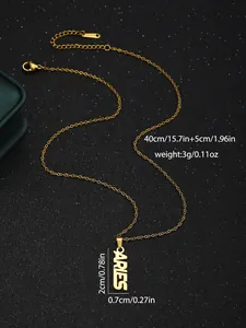 Close-up of 18K gold Aries necklace with S.STEEL tag and lobster clasp on black background