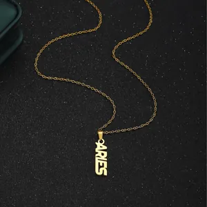 18K gold plated stainless steel Aries zodiac necklace with cutout letter pendant on black background