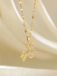 Close-up of gold-plated unicorn pendant necklace with shimmering cubic zirconia crystals