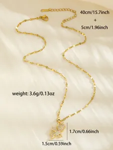 Detail of gold-plated bear pendant with shimmering crystals on a chic silk background