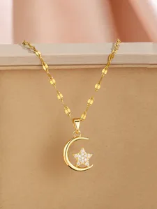 Detail showing gold crescent moon and pavé star pendant on textured chain link