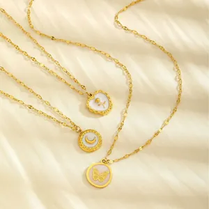Gold plated stainless steel necklaces with moon and butterfly shell pendants on silk