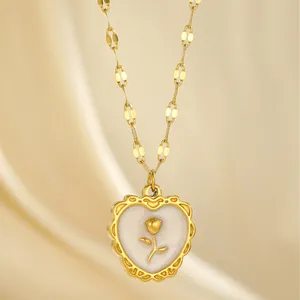Gold plated stainless steel heart necklace with rose flower shell inlay on silk fabric