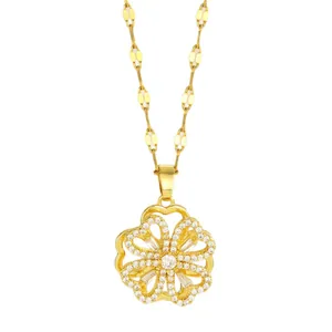 Golden flower pendant necklace with rotating zircon petals and sparkling crystal center