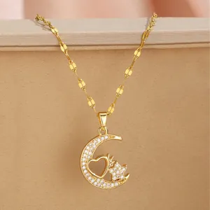 Elegant gold celestial necklace featuring a crescent moon, heart and star zircon pendant