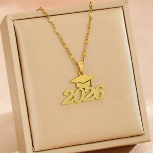 2026 graduation cap necklace in matte gold stainless steel displayed in a gift box