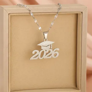 Silver 2026 graduation cap necklace in matte stainless steel on a display box