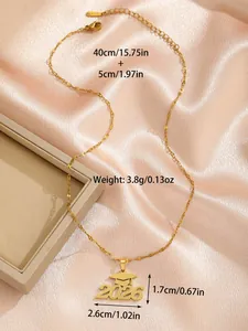 Detail of 2026 graduation cap pendant with frosted gold finish and stainless steel chain
